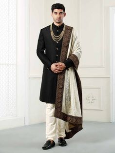 Featuring a Black quilted indowestern sherwani complemented with the georgette luckhnavi work shawl/dupatta with all over hand work on border.This is a designer piece that comes in process directly from our design house.Suitable for Indian Weddings, Bollywood parties and Indian Ceremonies, Perfect for Groom or Groomsmen.An ideal option to keep your persona composed & dignified for the wedding,sangeet event or a reception.Perfect for Groom or Groomsmen,family & friendsCOST INCLUDES SHERWA Sherwani For Men Wedding Royals, Sherwani For Men Wedding Indian Groom, Mens Wedding Wear Indian, Sherwani Groom Wedding, Indian Sherwani, Sherwani Wedding, Groom Sherwani, Sherwani For Men Wedding, Wedding Kurta For Men