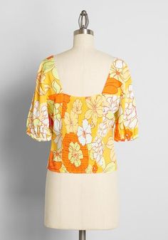 Seaside Cottage Getaway Tie-Front Top in Honolulu Floral | ModCloth Flowy Orange Summer Top, Flowy Orange Blouse For Vacation, Orange Flowy Top For Summer, Orange Summer Blouse For Vacation, Orange Floral Print Beach Top, Multicolor Tops For Brunch During Beach Season, Flowy Orange Top For Vacation, Retro Fitted Blouse For Vacation, Spring Fitted Tropical Print Tops