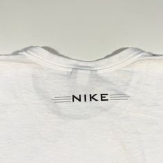 This is a vintage Nike shirt, it is in excellent condition with a minor print defect as shown and labeled as a size XXL. Measurements available upon request. Dri-fit Graphic Print T-shirt For Sportswear, Dri-fit Crew Neck T-shirt For Streetwear, Sporty Streetwear Shirt For Sports Season, Adidas Logo T-shirt For Sports Streetwear, Adidas Logo T-shirt For Streetwear During Sports Season, White Adidas Logo Top For Sports Season, White Adidas Logo Top For Sports, White Team Spirit Shirt For Streetwear, Sporty Streetwear Shirt With Team Name