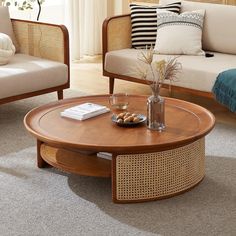 a living room with couches, chairs and a coffee table on carpeted floor