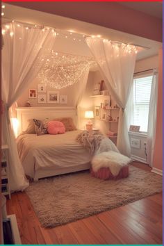 a bedroom with white curtains and lights on the ceiling