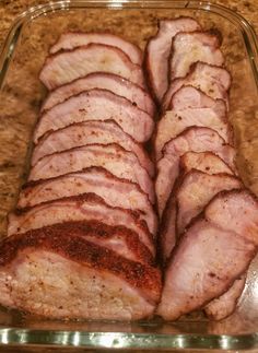 sliced meat in a glass dish on a counter