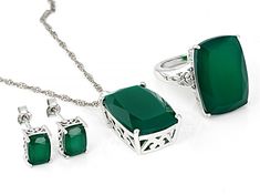 20x14mm and 8x6mm rectangular cushion green onyx rhodium over sterling silver ring, earrings and necklace boxed set. Pendant measures approximately 1 1/8"L X 9/16"W with 18" singapore chain. 3mm bail and lobster claw clasp with a 2" extender. Stud earrings measure approximately 5/16"L X 3/16"W with tension post backings. Solitaire ring measures approximately 3/4"L X 1/16"W. Not sizeable. Fine Emerald Jewelry In Rectangular Shape, Rectangular Emerald Fine Jewelry, Fine Jewelry Green Rectangular Jewelry, Green Rectangular Fine Jewelry, Formal Jewelry With Polished Rectangular Stone, Fine Jewelry Green Jewelry Sets As Gift, Silver Emerald Jewelry Sets For Gift, Fine Jewelry Green Jewelry Sets, Fine Jewelry Green Jewelry Sets For Gift