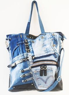 a handbag made out of old jeans and studded leathers is hanging on a wall