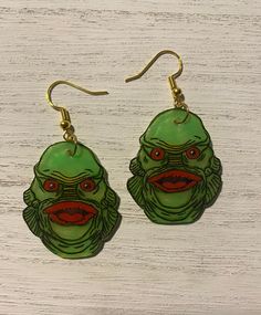 Creature from the black lagoon earrings ! All earrings are handmade and no two pair are exactly alike! Perfect for the spooky season ahead. Horror Merchandise, Creature From The Black Lagoon, The Black Lagoon, Black Lagoon, Book Case, Spooky Season, Etsy Finds, The Black, Jewelry Earrings Dangle