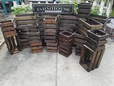 several wooden crates stacked on top of each other in front of a sign that says farmhouse