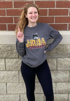 Loyola Ramblers Charcoal Big Logo Long Sleeve T Shirt - 22784075 Fall Sports Long Sleeve T-shirt, Collegiate Long Sleeve Winter T-shirt, Fall Sports Long Sleeve Tops, Gray T-shirt For College In Fall, Gray Sporty T-shirt For Fall, Collegiate Long Sleeve Top With Ribbed Cuffs, Long Sleeve Cotton Sports Top, Relaxed Fit Long Sleeve Tops For College, Collegiate Sports Tops For Fall