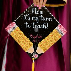 a graduate's cap that says, now it's my turn to teach