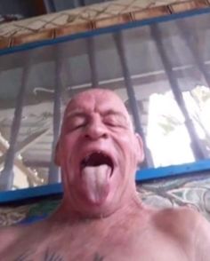 an image of a man sticking his tongue out and making a face with his mouth wide open