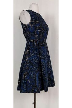 Feel flirty and feminine when you slip into this stunning dress. Made in a fun print with a fit & flare silhouette. You will love how versatile it is. Size 2 Made in U.S.A Rounded neckline Concealed back zipper Fit & flare Lined Printed fabric Above knee Bust 31" Waist 27" Shoulder to hem 35" Printed A-line Blue Mini Dress, Blue Printed A-line Mini Dress, Blue A-line Mini Dress With Print, Fitted A-line Printed Mini Dress, Blue A-line Midi Dress With Flattering Silhouette, Printed A-line Mini Dress For Party, Blue Fitted A-line Dress, Elegant Blue Dress With Abstract Print, Blue A-line Fitted Dress