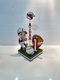 a cake that is shaped like a baseball player