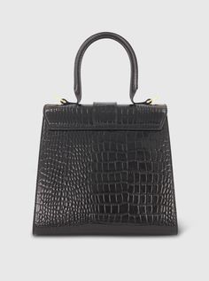 Elevate your style with our Buckled Croco Leather Handbag. With its timeless design and impeccable craftsmanship, it's the perfect accessory to complement any look. Mac Duggal Crocodile Embossed Leather Construction Croc-embossed and 24k Gold-plated hardware Chic top handle bag with a 22" in detachable strap for shoulder or crossbody wear Flap with magnetic closure Medium size: W 9.8 in x H 14.5 in x D 4.7 in (metric: 25cm X 23cm X 12cm) Microfiber faille lining; 100% PU Fits up to: iPhone 14, A Formal Leather Satchel With Crocodile Pattern, Classic Formal Shoulder Bag With Crocodile Pattern, Classic Crocodile Pattern Shoulder Bag For Formal Occasions, Leather Bag With Crocodile Pattern For Formal Occasions, Leather Bags With Crocodile Pattern For Formal Events, Formal Leather Bags With Crocodile Pattern, Formal Black Crocodile Pattern Shoulder Bag, Luxury Evening Bag With Crocodile Pattern, Evening Rectangular Shoulder Bag With Crocodile Pattern