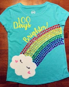 a t - shirt with a rainbow and clouds on it