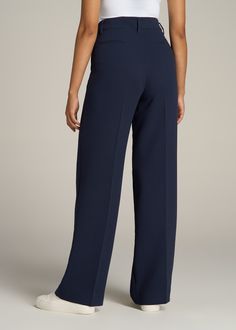 About Our Extra-Long Women’s Dress Pants Make a statement in these stylish pleated women’s tall dress pants. Pleated trousers are a timeless trend you’ll love and now, there’s finally a pair that will accentuate your long legs. These pants for tall women have been designed specifically for ladies between 5’9” and 6’6”, with a full length offering extra-long inseam options. They have a high-rise silhouette that gives the appearance of a cinched waist, complete with a fly zipper and hook and bar c Pants For Tall Women, Long Knife, Blue Slacks, Pleated Dress Pants, Dark Blue Pants, Tall Dress, Knife Pleats, Tall Dresses, Wide Leg Dress Pants