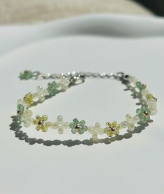 Free shipping for orders over $35 Handcrafted floral bracelet featuring exquisite jade-like and pearl like beads. Long Bead Bracelet, Cheap Elegant Flower Shaped Beaded Bracelets, Floral Bead Bracelet, Bracelet Flower, Bracelets Design, Seed Bead Bracelet, Floral Bracelet, Beads Bracelet Design, Earring Ideas