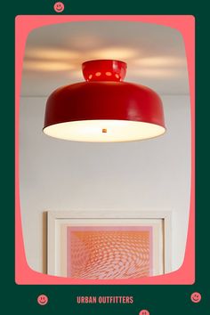 a red light hanging from the ceiling in a room