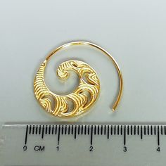 ONE PAIR of open ended sterling silver spiral hoops plated in real gold. Dimensions: 27 X 28 mm These earrings are made of 925 hypoallergenic sterling silver and plated in gold. Comes with a 925 stamp. Can be packaged in a gift box. I can include a personal message from you if needed You are welcome to contact me at... bhavnakwintra1956@gmail.com For more beautiful pieces from my shop, please browse 👇 TOE RINGS: https://www.etsy.com/your/shops/TheSilverGame/tools/listings/section:27020628,view: Gold Spiral Brass Hoop Earrings, Spiral Gold Hoop Earrings In Brass, Gold Swirl Earrings For Pierced Ears, Gold Spiral Earrings For Pierced Ears, Gold Spiral Single Earring, Gold Spiral Wrap Single Earring, Handmade Spiral Gold Earrings, Gold Spiral Wrap Earrings With Ear Wire, Gold Spiral Hoop Earrings