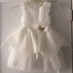 Perfect For Baptism Or Flower Girls. White Tulle And Flutter Detail On Sleeves. Butterfly Brooch On Waist. Spring Baptism Tutu Dress With Bow, Summer Baptism Tutu Dress With Bow, Summer Tutu Dress With Bow For Baptism, White Bow Tutu Dress For Summer, Spring Baptism Princess Dress With Bow, Spring Princess Dress With Bow For Baptism, Fitted Tutu Dress With Bow For Baptism, Spring First Communion Dress With Bow, Elegant Ruffled Tutu Dress For First Communion