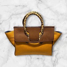 This is a one of a kind leather purse.  This caramel and brown leather purse is 9 tall and 9 inches wide.  with the flap open it is 14 inches. Brown Rectangular Flap Bag For Shopping, Brown Flap Bag For Shopping, Brown Rectangular Satchel With Removable Pouch, Brown Leather Top Handle Satchel, Brown Flap Bag With Detachable Strap And Double Handle, Camel Rectangular Satchel With Removable Pouch, Brown Satchel With Leather Lining And Double Handle, Brown Flap Shoulder Bag With Detachable Handle, Brown Satchel With Leather Lining For Daily Use