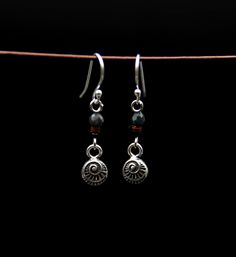 ✅Handmade earrings made from real silver Pendant in small spiral shape and blue garnet bead with real silver ear hook  ✅ Simple but elegant natural look. For nature lovers who love minimalist but elegant jewelry.  ✅ Dimensions Total length 3.5 cm Width of the silver pendant 0.7 cm  ✅ Material Spiral pendant made from 100% 925 sterling silver. Small blue garnet bead, shell discs and black rocaille bead. The earrings are simple and lightweight, the ear hook is made of 925 silver as is the silver s Small Silver Earrings, Spiral Pendant, Natural Jewelry, Spiral Shape, 2 Earrings, Le Crochet, Ear Hook, Single Earring, Nature Jewelry