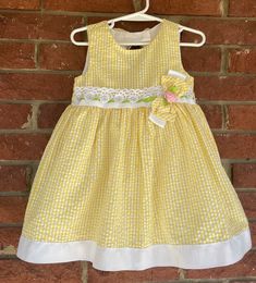 "Toddler Dress, vintage sundress, size 24M 24 mo, Rare Editions, 80s 90s, fancy, yellow gingham, bow flower lace, Easter dress, wedding, vaca Rare Editions size 24 months 55% Cotton 45% Polyester Shoulder to hem: 20\" pit to pit 12\" beautiful details - ribbons, bows an lace! Interested in more vintage fashion or handmade items? etsy.com/shop/canzaliaprons" Fitted Yellow Dress With Bow, Spring Gingham Dresses Lined, Picnic Gingham Dress With Lace Trim, Spring Gingham Lined Dress, Spring Picnic Dress With Bow, Yellow Spring Dress With Bow, Cute Yellow Dresses With Lace Trim, Cute Yellow Dress With Lace Trim, Cotton Gingham Dress With Lace Trim