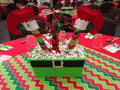 a decorated table with red, green and white decorations