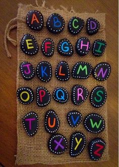 the letters and numbers are made out of felt on a burlocked sack