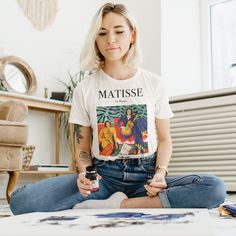 🎨 Elevate Your Wardrobe with Artistic Elegance! 🌟 Introducing our Matisse-inspired t-shirt collection, where the timeless genius of Henri Matisse meets modern fashion. If you appreciate the masterpieces of this iconic artist, our shirts are designed just for you. 🖌️👚 🌿 Artistry Meets Wearability 🌿 Our Matisse t-shirts are not merely clothing; they are wearable art. Each design has been carefully curated to encapsulate the essence of Matisse's work. From vibrant abstracts to organic shapes Artsy Short Sleeve T-shirt With Artwork, Artsy Summer T-shirt, Artsy White T-shirt With Artwork, Artistic Short Sleeve Top With Artwork, Relaxed Fit T-shirt With Custom Artwork For Artistic Expression, Graphic Cotton Tee With Artwork, Graphic Tee With Artwork For Summer, Summer Graphic Tee With Artwork, Artsy Summer Tops With Artwork