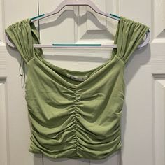 New With Tags Color Green Size M Will Ship Within 2 Business Days Price Is Negotiable So Feel Free To Make Me An Offer:) This Top Is So Fun And Perfect For Warm Weather! I Added Model Photos Of The Top In Another Color Casual Cotton Ruched Tank Top, Trendy Ruched Tops For Spring, Casual Green Crop Top For Spring, Casual Ruched Crop Top For Spring, Casual Ruched Crop Top For Day Out, Spring Ruched Cotton Crop Top, Casual Ruched Tops For Day Out, Ruched Trendy Tank Top For Spring, Trendy Ruched Tank Top For Spring