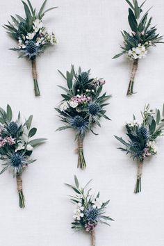 six bouquets of flowers arranged on a white surface with green leaves and pink blooms