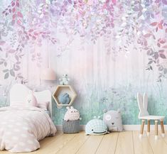 a child's bedroom decorated in pastel tones with pink and blue flowers on the wall