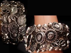 "This bracelet has about 48 silver metal buttons and each one is different. The charm of this is that you are going to be able to wear bottoms representing some of the most wonderful era's of jewelry and clothing. There are Pharaoh heads, knights, fleur de lis, insects , animals,, coin, anchors,horse, cowboy, devil face,cameo,medical symbol, door knocker, heart, buckle, padlock and key, harp, scottish terrier Scottish Native american and MUCH more! This is really wide ( 2\" ). The edges are made Devil Face, Madonna Statue, Horse Cowboy, Lion Star, Medical Symbols, Viking Glass, Spring Hill, Door Knocker, Scottish Terrier