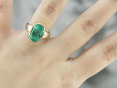 This vintage emerald ring is a simple, and quite a versatile piece with clean lines and great proportions. This ring is classic and traditional, featuring a solid gold head to hold the stone securely. The beautiful emerald has a shade of green that is just the same as the brightest springtime leaves. Metal: 14K Yellow Gold Gem: Emerald 4.08 Carats Gem Measurements: 12.1 x 8.5 mm, Oval Ring Size: 6 Marks: "KIMBERLY 14K" Stamped on the inside band Vintage Emerald Ring, Emerald Ring Vintage, Sapphire Solitaire Ring, Right Hand Ring, Sapphire Solitaire, Ring Emerald, Right Hand Rings, Hand Ring, Oval Ring