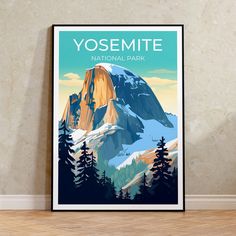 the yosemite national park poster is displayed in front of a wall with wood flooring