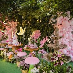 a garden filled with lots of flowers and balloons