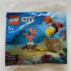 a bag of lego city underwater scene with corals and sea creatures in the background