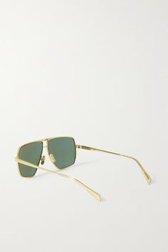 Find CELINE Oversized Aviator-style -tone Sunglasses on Editorialist. CELINE Eyewear's striking sunglasses are made from glossy gold-tone metal with oversized, aviator-style frames for maximum coverage. The dark lenses provide full-spectrum protection. Modern Gold Aviator Sunglasses With Tinted Lenses, Modern Gold Aviator Sunglasses With Square Frame, Modern Gold Shield Sunglasses With Square Frame, Modern Gold Square Frame Aviator Sunglasses, Modern Gold Shield Sunglasses For Formal Occasions, Modern Gold Shield Sunglasses For Formal Events, Modern Gold Shield Sunglasses With Tinted Lenses, Modern Gold Tinted Shield Sunglasses, Designer Gold Aviator Sunglasses With Uv Protection