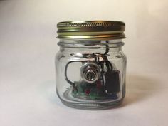 a glass jar with some wires in it