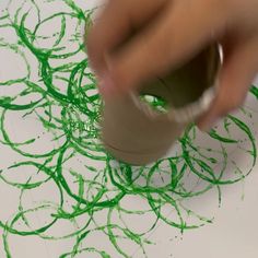 someone is making something with green crinkle paint