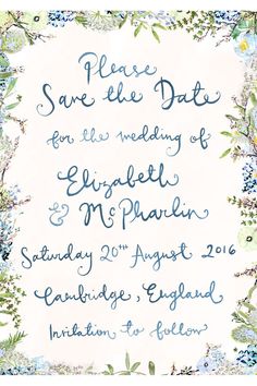 a wedding card with blue flowers and greenery on the front, in an ornate frame