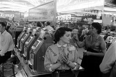 an old black and white photo of people shopping in a store with the caption life