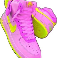 a pair of pink and yellow nike sneakers