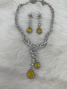 Teardrop Necklace With Matching Earrings For Parties, Party Teardrop Necklace With Matching Earrings, Yellow Clavicle Chain Necklace For Party, Elegant Yellow Teardrop Pendant Jewelry, Yellow Crystal Necklace For Party, Party Clavicle Chain Jewelry With Teardrop Pendant, Yellow Crystal Necklace For Weddings, Formal Yellow Teardrop Pendant Jewelry, Yellow Pendant Jewelry For Wedding