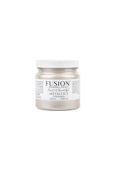 a jar of metallic paint on a white background with the words fuson written in it