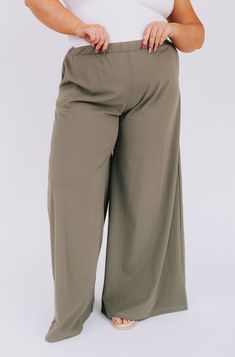 Our PLUS SIZE - Beyond Compare Pants are the perfect addition to your closet! Made with a smokey sage color and wide-legged style, these pants are sure to add a stylish touch to any look. Plus, they boast an elastic waistband for comfort and convenient pockets for convenience. So go ahead—it's impossible to go wrong with these pants! Details Wide leg Elastic waistband Pockets! Soft Sizing Approximate measurements: SIZE LENGTH WAIST INSEAM 1XL 43” 32” 31” 2XL 43” 34” 31” 3XL 44” 36” 31” Fabric has stretch Model is 5’8” wearing 3XL Material 92% Nylon 8% SpandexHand wash cold No bleachHang dryOr dry clean Olive Wide Leg Relaxed Fit Pants, Olive High-waisted Pants For Spring, Olive Bottoms With Elastic Waistband For Spring, Olive Wide Leg Pants For Spring, Fall Wide Leg Khaki Pants With Elastic Waistband, Olive Wide Leg Pants With Elastic Waistband, Khaki Wide Leg Pants With Elastic Waistband For Fall, Casual Olive Wide-leg Pants, Olive Wide Leg Pants For Fall