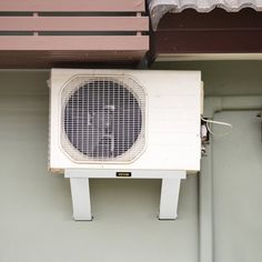 an air conditioner mounted on the side of a building