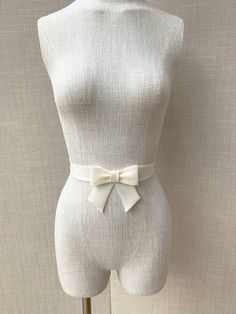 This super elegant delicate bridal belt is beautifully hand made out of silk organza. It features center bow detail with the hanging tails. The belt is finished in the back with the hidden clasp. Available in white, off white or ivory, please see the last photo for the color reference. This belt measures 1 1/4" wide and the length is finished to your measurements. Shown in the photos in ivory. We can make this belt in any other color if needed, please inquire about the custom order. * Please inc Bow Wedding, Wedding Belt, Wedding Sash Belt, Bow Belt, Silk Bow, Bridal Earrings Pearl, Wedding Belts, Bridal Belt, Silk Organza