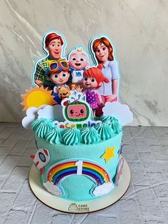 a birthday cake decorated with cartoon characters on it