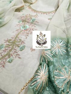 Item Overview ATHARVA Hand Embroidered Salwar Kameez w/Elegant Neck in Light Green(Pista) and w/ Chiffon Dupatta with Aari and Gota work jaal. CH1016 Dno. CH1016 Fabric:  * Shirt Chanderi in Light Green (Pista)  2.5 Mts, with jaal and Side Gota work * Dupatta: Pure Chiffon Dupatta in Pista w/Aari and Gota work 2.5Mts * Bottom Santoon Silk in (Pista) Light Green 2.5 Mts. Excusive Hand Embroidered Party Wear Punjabi Suit. Customization: * Fabrics: Designs Can be made in different Fabrics. * Stitch Pista Green Semi-stitched Suit For Diwali, Semi-stitched Green Salwar Kameez With Dori Work, Designer Anarkali Set With Intricate Embroidery In Pista Green, Designer Pista Green Anarkali Set With Intricate Embroidery, Designer Anarkali Set In Pista Green With Intricate Embroidery, Designer Tissue Silk Salwar Kameez For Festivals, Festival Sets With Intricate Embroidery In Pista Green, Transitional Chikankari Embroidery Dola Silk Sets, Pista Green Tissue Silk Set With Intricate Embroidery