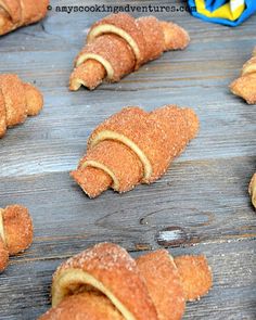 croissants are arranged on a wooden table